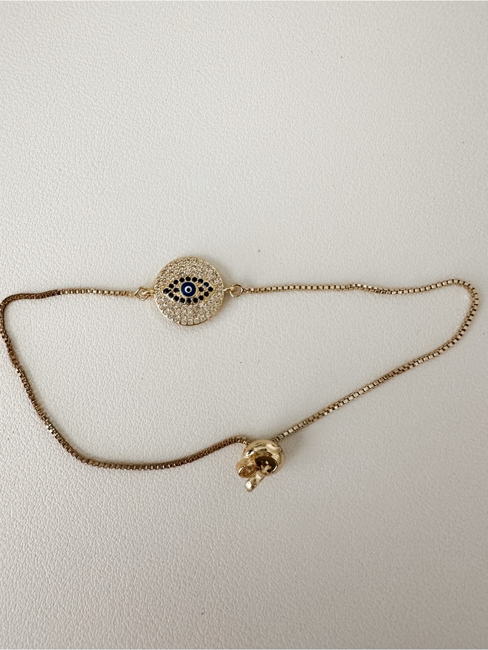 Gold Evil Eye Pendant Bracelet with Blue Accent